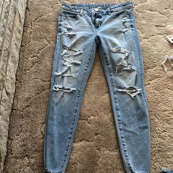 American Eagle Jeggings. Light blue in color with holes down both legs. - Picture 2 of 6